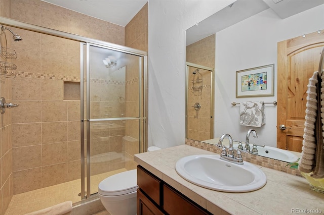 14370 Osage St, Westminster, CO 80023 - full bathroom featuring a shower stall, toilet, and vanity