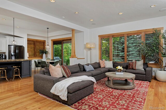 14370 Osage St, Westminster, CO 80023 - living area with healthy amount of natural light, light wood-type flooring, and recessed lighting
