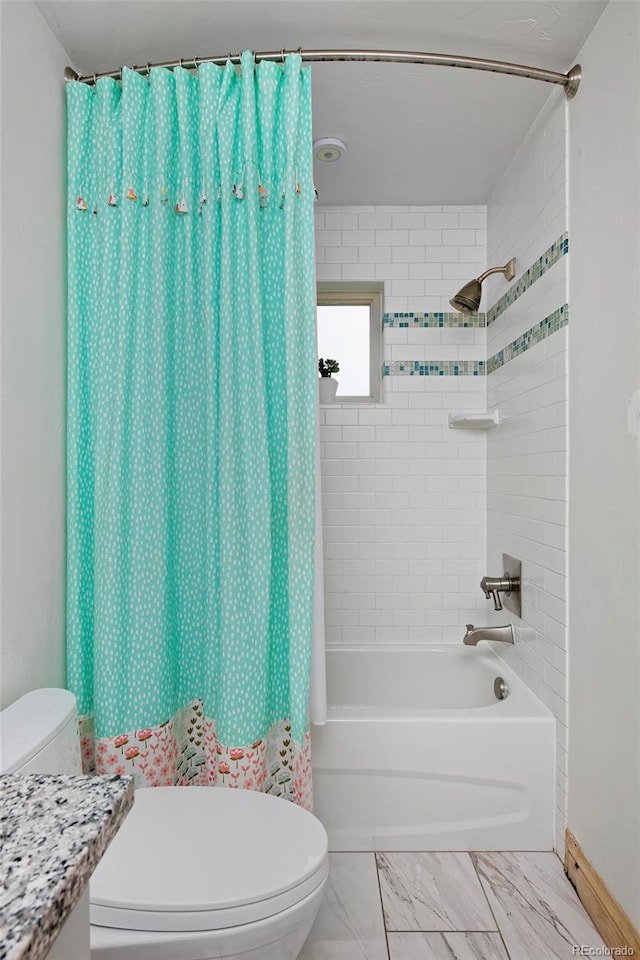 14370 Osage St, Westminster, CO 80023 - bathroom featuring shower / tub combo with curtain, marble look tiles, and vanity