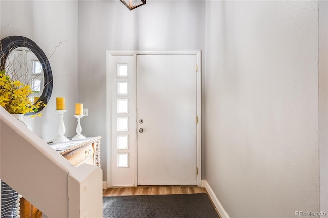 entryway with hardwood / wood-style flooring