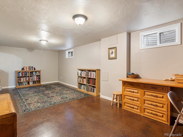 14050 E 25th Pl, Aurora, CO 80011 - office area featuring baseboards and concrete floors