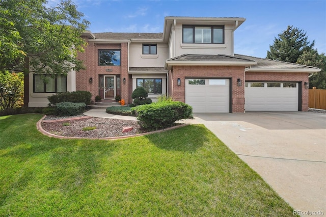 view of front of property featuring a front yard, concrete driveway, and brick siding