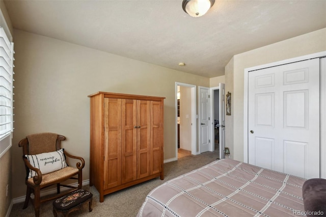 bedroom featuring light colored carpet