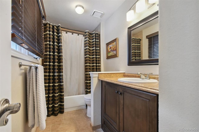 full bath featuring toilet, shower / bath combo, vanity, and tile patterned floors