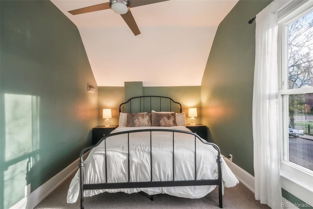 bedroom with baseboards, carpet, ceiling fan, and vaulted ceiling