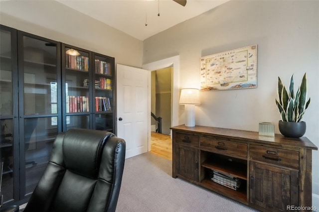 office area featuring ceiling fan and light carpet