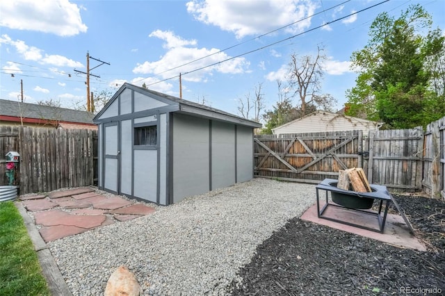 view of shed with a gate and a fenced backyard