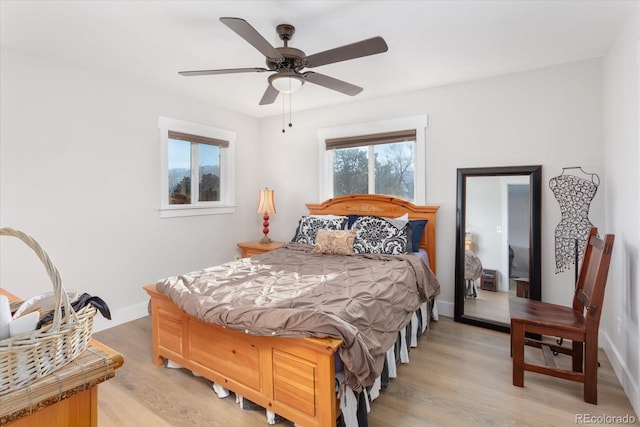 bedroom featuring light hardwood / wood-style flooring and ceiling fan