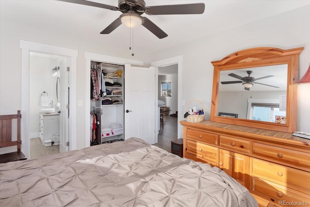 bedroom with ensuite bath, light hardwood / wood-style flooring, a closet, and ceiling fan