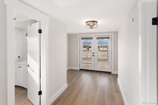 interior space featuring french doors and light hardwood / wood-style floors