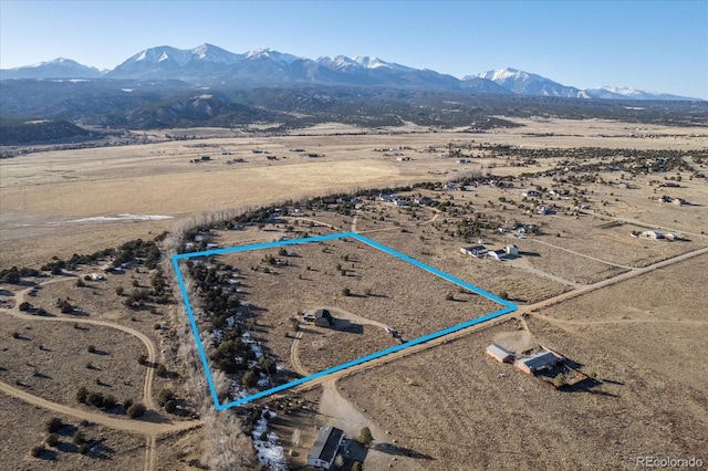 birds eye view of property featuring a mountain view