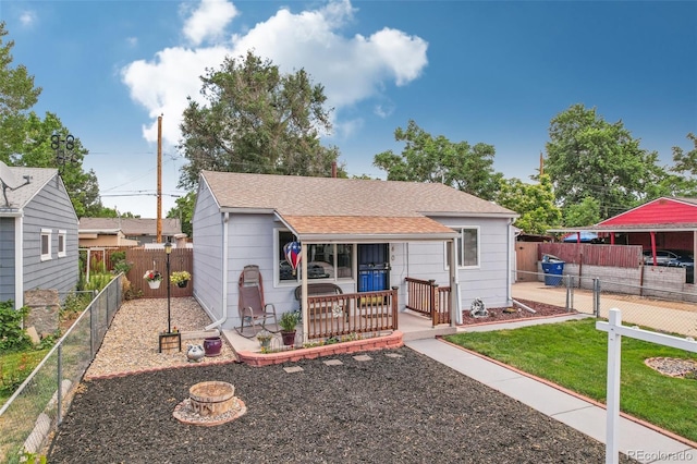 bungalow-style home with a front yard