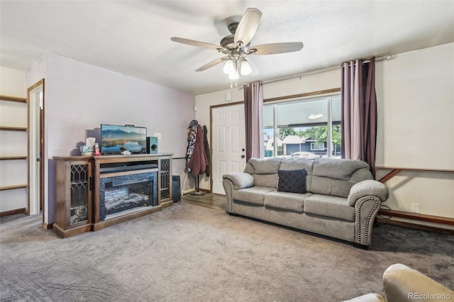 carpeted living room with ceiling fan