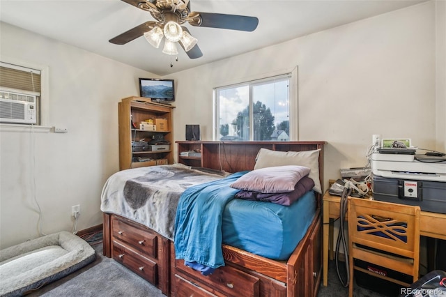 bedroom with ceiling fan and cooling unit