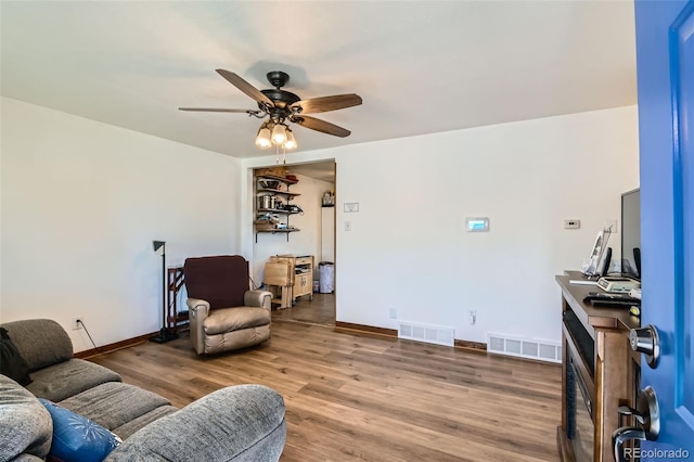7940 Pontiac St, Commerce City, CO 80022 - living area featuring wood finished floors, visible vents, a ceiling fan, and baseboards