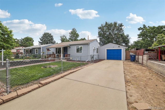 7940 Pontiac St, Commerce City, CO 80022 - view of front of house with a detached garage, concrete driveway, a front lawn, fence private yard, and an outbuilding