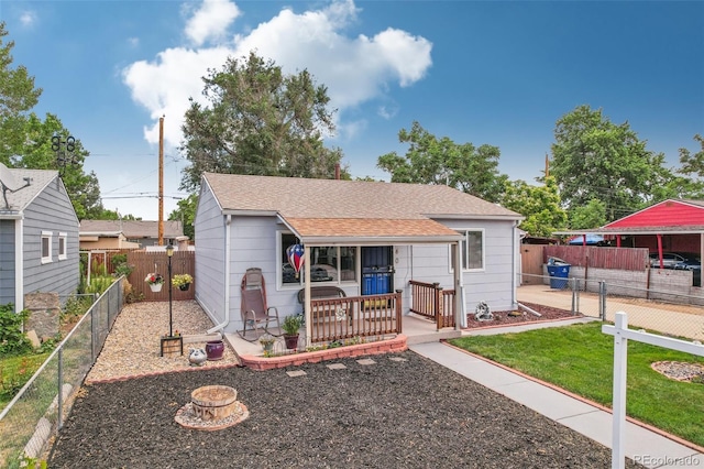 7940 Pontiac St, Commerce City, CO 80022 - bungalow-style house with a fenced backyard, a front lawn, a porch, and a shingled roof