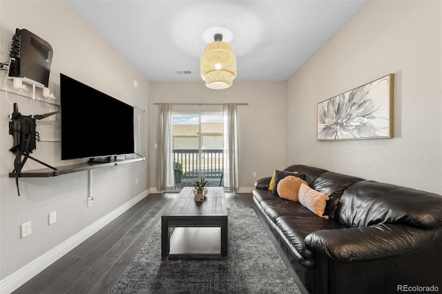 1831 S Dunkirk St Unit 103, Aurora, CO 80017 - living room featuring baseboards and wood finished floors