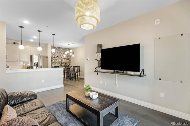 1831 S Dunkirk St Unit 103, Aurora, CO 80017 - living room with dark wood-type flooring and recessed lighting