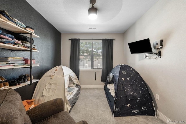 1831 S Dunkirk St Unit 103, Aurora, CO 80017 - sitting room with carpet floors and baseboards