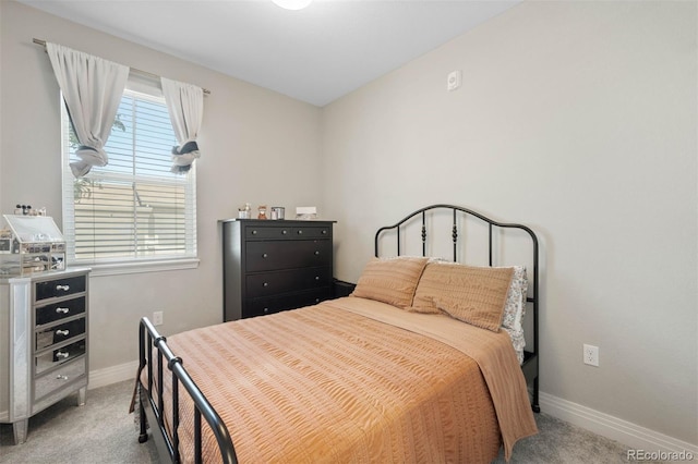 1831 S Dunkirk St Unit 103, Aurora, CO 80017 - bedroom with light colored carpet and baseboards