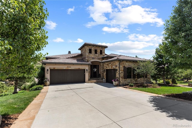 8000 Raphael Ln, Littleton, CO 80125 - mediterranean / spanish-style home with stone siding, a garage, a tile roof, and concrete driveway