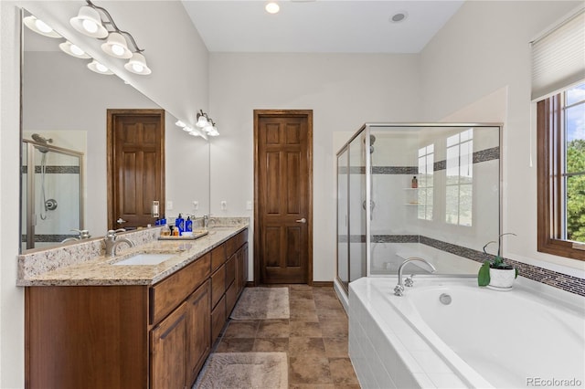 8000 Raphael Ln, Littleton, CO 80125 - full bathroom with a garden tub, a shower stall, and double vanity