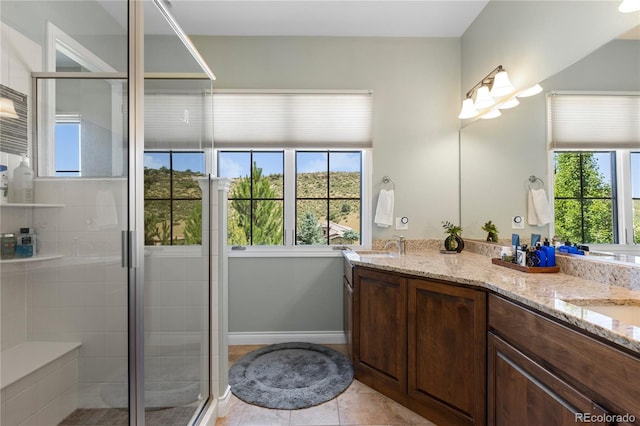8000 Raphael Ln, Littleton, CO 80125 - full bathroom with double vanity, a shower stall, and tile patterned floors
