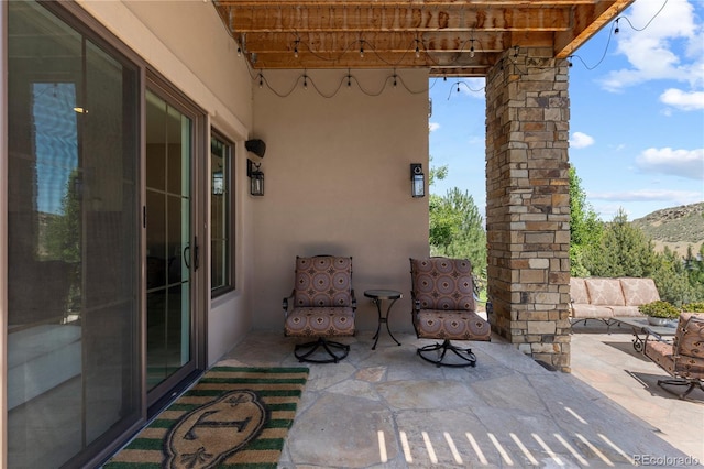 8000 Raphael Ln, Littleton, CO 80125 - view of patio with a mountain view