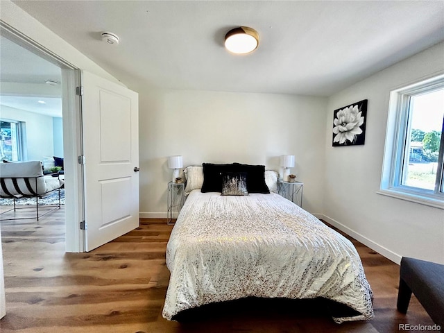 bedroom with wood-type flooring