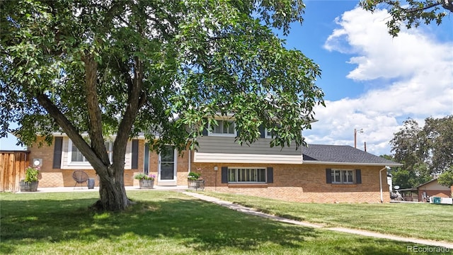 9629 Yukon Ct, Westminster, CO 80021 - split level home with a front yard and brick siding