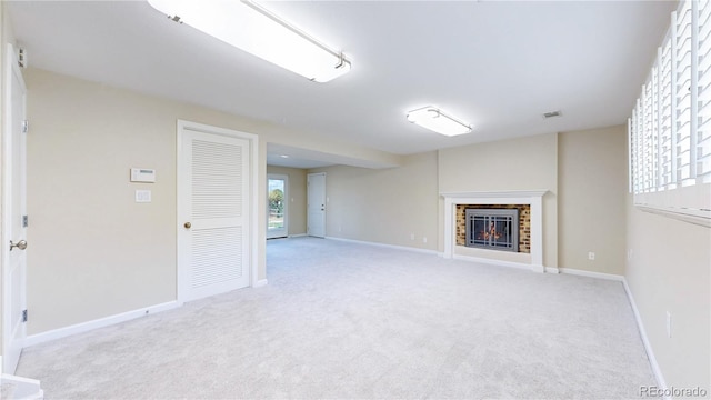 9629 Yukon Ct, Westminster, CO 80021 - unfurnished living room with light colored carpet and a brick fireplace