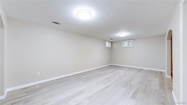 9629 Yukon Ct, Westminster, CO 80021 - basement featuring light wood finished floors and arched walkways