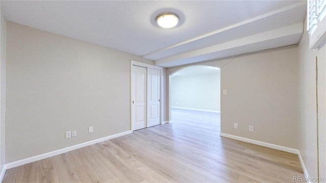 9629 Yukon Ct, Westminster, CO 80021 - unfurnished room with arched walkways and wood finished floors