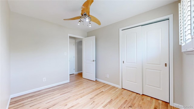 9629 Yukon Ct, Westminster, CO 80021 - unfurnished bedroom with wood finished floors, a closet, and a ceiling fan