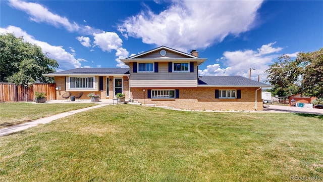9629 Yukon Ct, Westminster, CO 80021 - split level home with a chimney and brick siding
