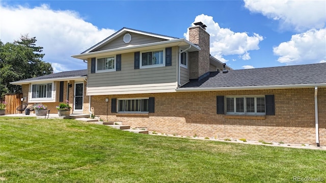 9629 Yukon Ct, Westminster, CO 80021 - split level home with a chimney, brick siding, and a front yard