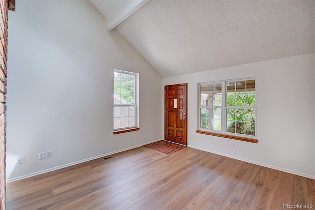2713 W Long Dr Unit C, Littleton, CO 80120 - entrance foyer featuring beam ceiling, wood finished floors, and high vaulted ceiling