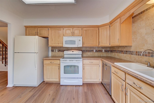 2713 W Long Dr Unit C, Littleton, CO 80120 - kitchen featuring white appliances, light brown cabinets, and decorative backsplash