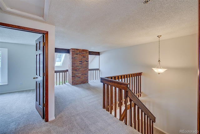 2713 W Long Dr Unit C, Littleton, CO 80120 - hallway with carpet flooring, an upstairs landing, and a textured ceiling