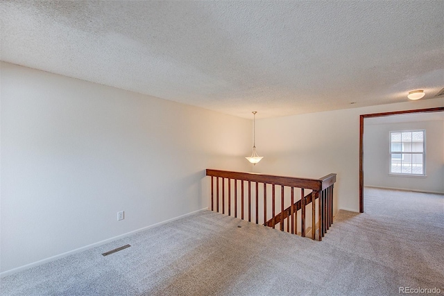 2713 W Long Dr Unit C, Littleton, CO 80120 - carpeted spare room featuring a textured ceiling