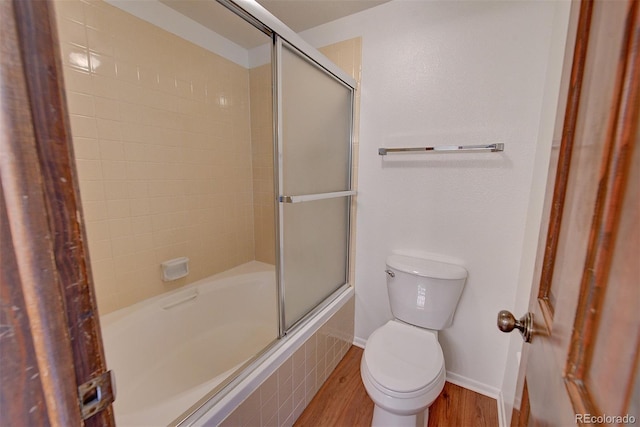 2713 W Long Dr Unit C, Littleton, CO 80120 - bathroom featuring tiled shower / bath combo and wood finished floors