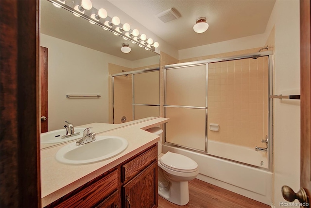 2713 W Long Dr Unit C, Littleton, CO 80120 - bathroom with vanity, wood finished floors, and enclosed tub / shower combo