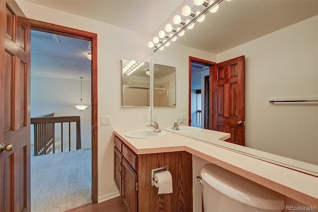 2713 W Long Dr Unit C, Littleton, CO 80120 - full bathroom with double vanity and wood finished floors