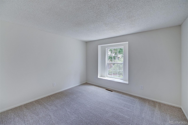 2713 W Long Dr Unit C, Littleton, CO 80120 - carpeted spare room featuring a textured ceiling