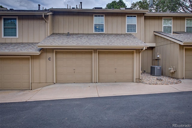 2713 W Long Dr Unit C, Littleton, CO 80120 - view of front of home featuring a garage, board and batten siding, and concrete driveway