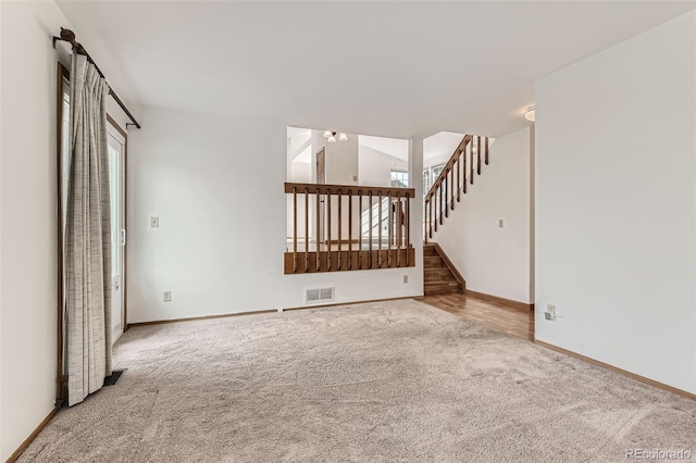 unfurnished living room with carpet flooring