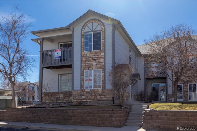 traditional home with stone siding