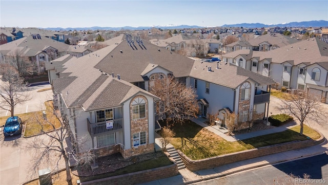 birds eye view of property featuring a residential view and a mountain view