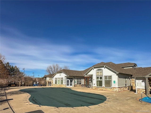 pool featuring a patio area